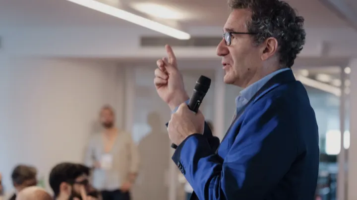 Giovanni Giamminola speaking with a microphone